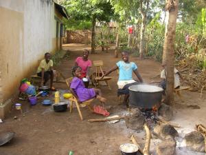 60 - Porridge on the cooking fire - Mr James tries to give every child a meal each day.