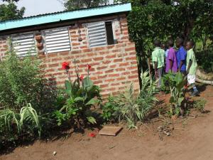 32 - The children lining up at their new latrines