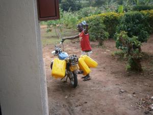 Off to get water with homemade funnel